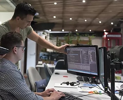 Technology professionals collaborating in an office